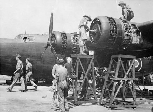 Normal mechanics servicing the pratt whitney twin wasp radial engines of a liberator mk ii of no 159 squadron raf at salbani india